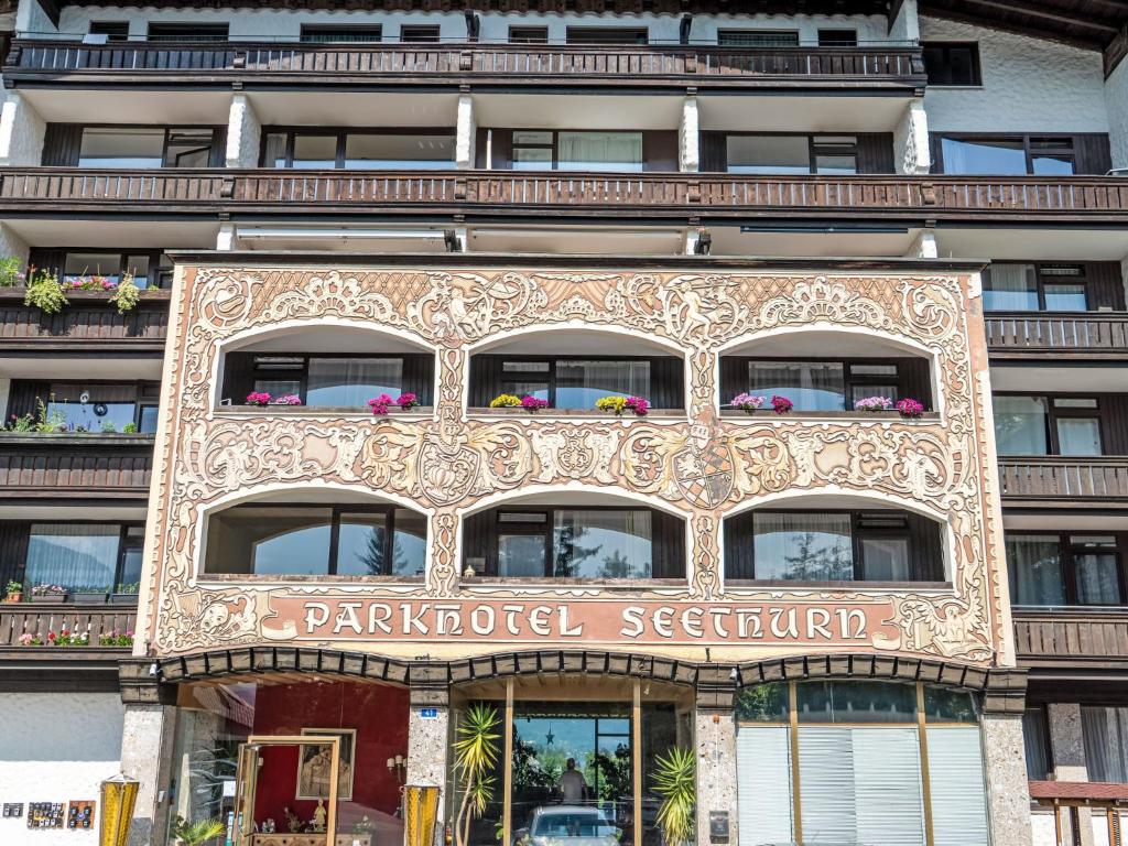 a building with a sign on the side of it at Apartment Penthouse Deluxe Galerie 2 stöckig by Interhome in Strobl