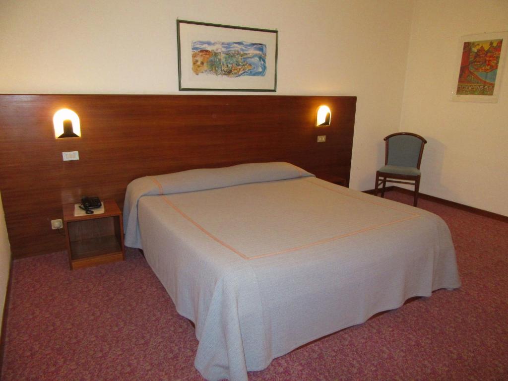 Postel nebo postele na pokoji v ubytování Hotel Giardino