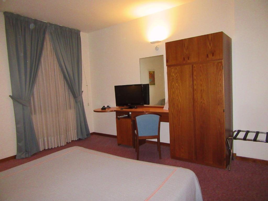 TV a/nebo společenská místnost v ubytování Hotel Giardino