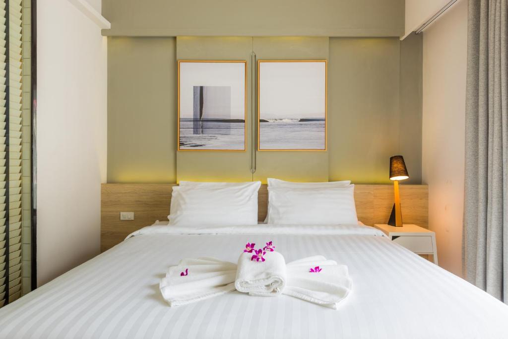 Postel nebo postele na pokoji v ubytování Snoozz Hotel Krabi