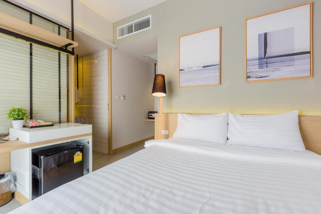 Postel nebo postele na pokoji v ubytování Snoozz Hotel Krabi