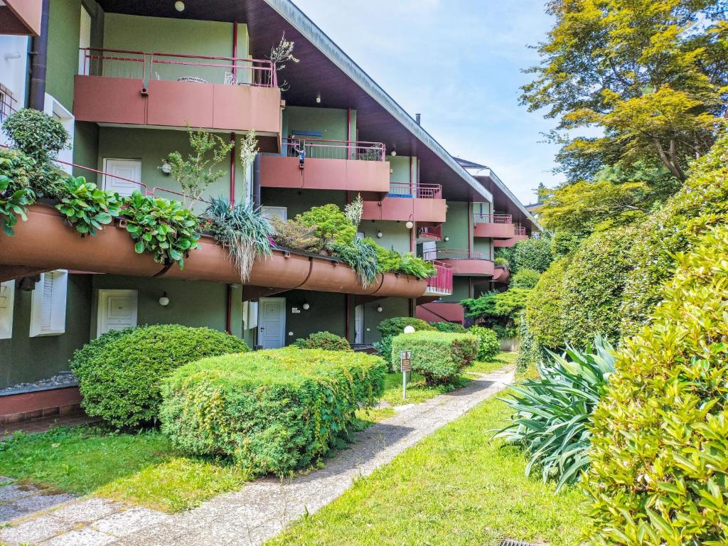 an apartment building with plants on the balconies at Apartment Norby by Interhome in Ghiffa