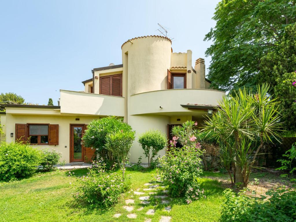 a house with a tower on top of it at Villa Villa Al Mare by Interhome in Su Forti