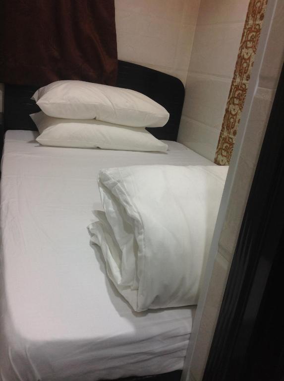Postel nebo postele na pokoji v ubytování Manhattan Guesthouse