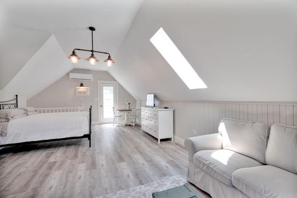 a living room with a bed and a couch at The Euphrates in Cavendish