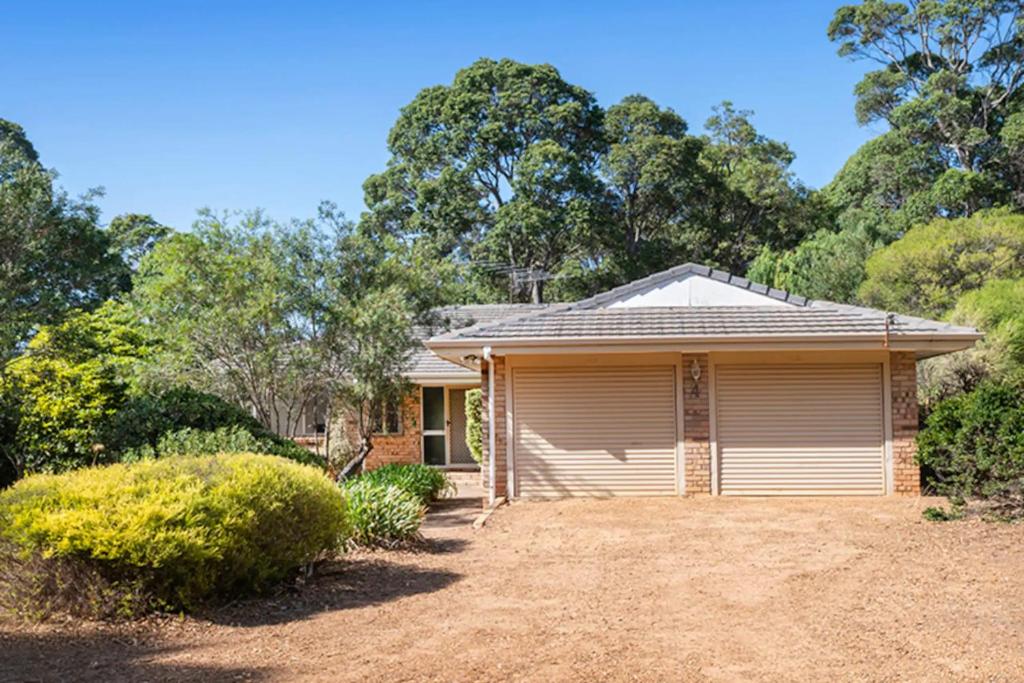 a house with a garage in front of it at Marg's Retreat - Pet Friendly - Families Welcome in Margaret River Town