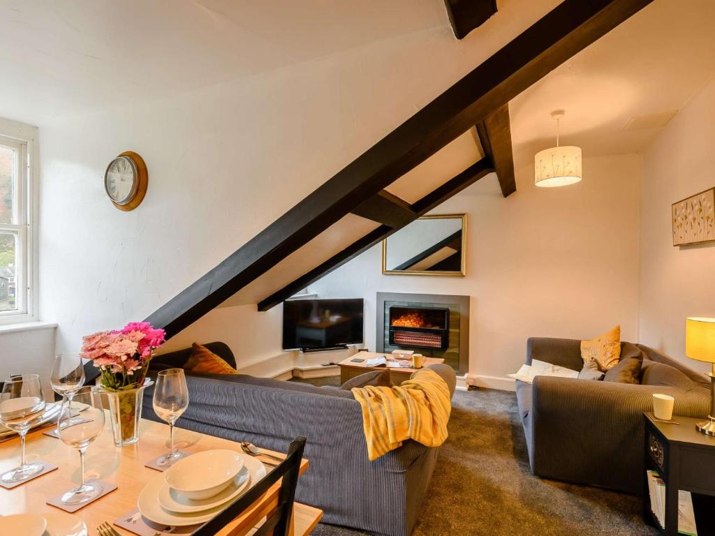 a living room with a couch and a table at 4 Bed in Keswick 86392 in Rosthwaite