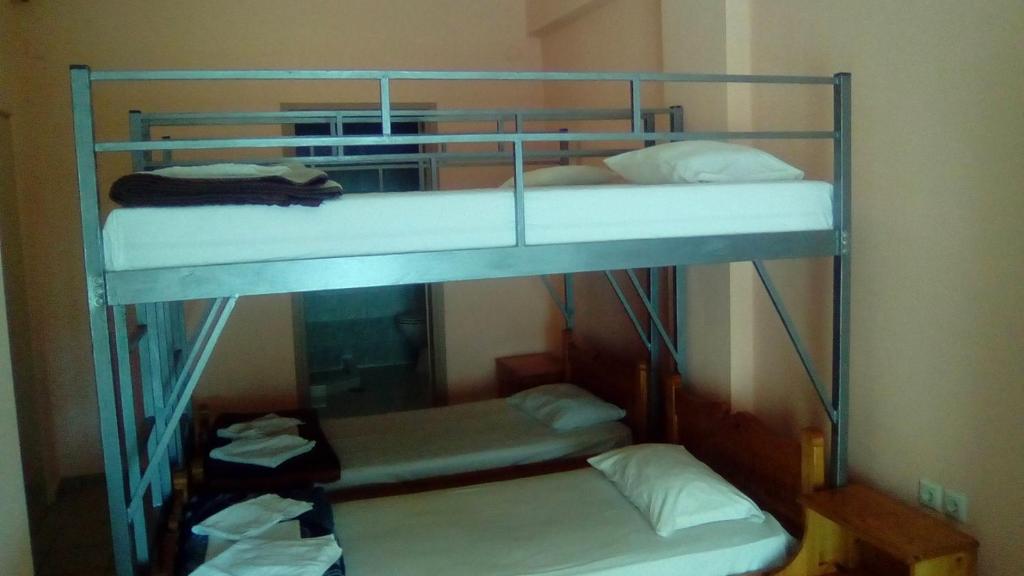 two bunk beds in a room with towels at Constantinos Budget Beds in Chania