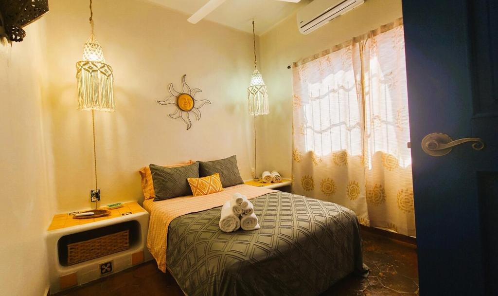 Postel nebo postele na pokoji v ubytování Casa Rosa Paradise