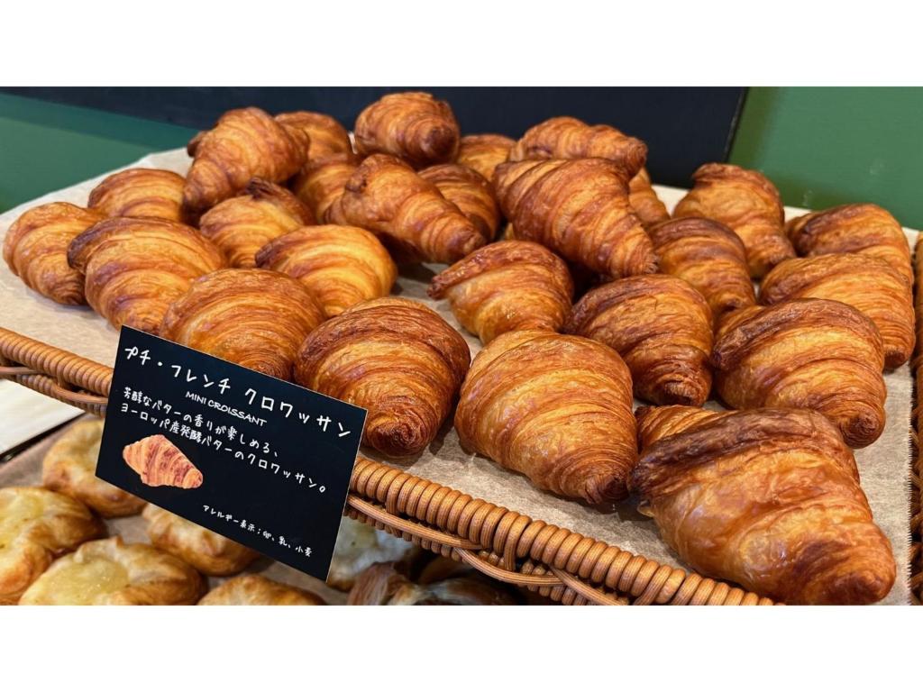 a display of croissants and other pastries on a table at Smile Hotel Sapporo Susukino Minami - Vacation STAY 60199v in Sapporo