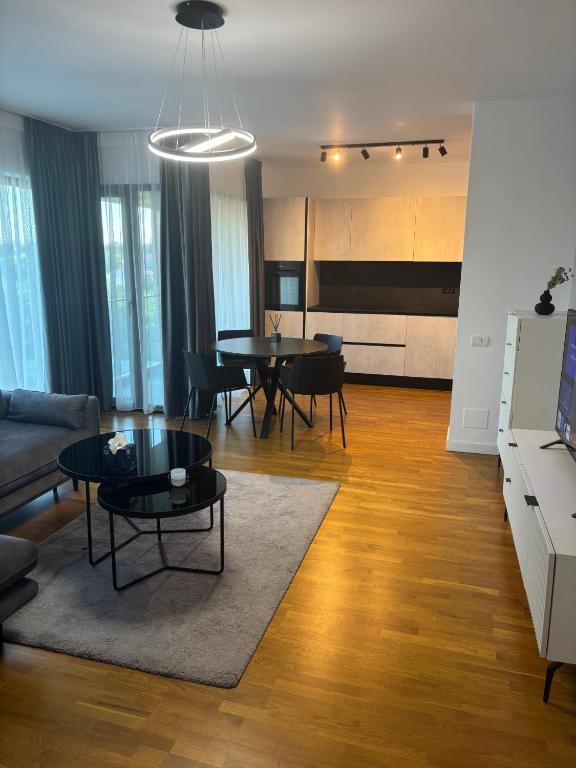 a living room with a couch and a table at Aviatiei-Boutique in Bucharest