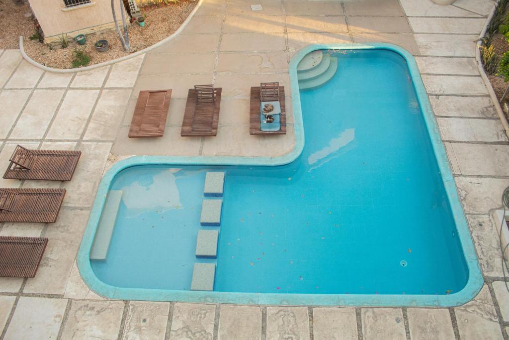 an overhead view of a blue swimming pool at Walk 2 blocks to the beach and downtown! in Cabo San Lucas