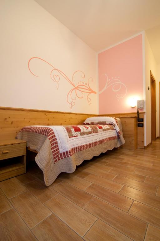 Postel nebo postele na pokoji v ubytování Hotel Sport