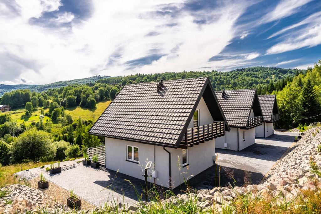 a house on the side of a hill at Zielone Wzgórze- domki całoroczne Zawoja in Zawoja