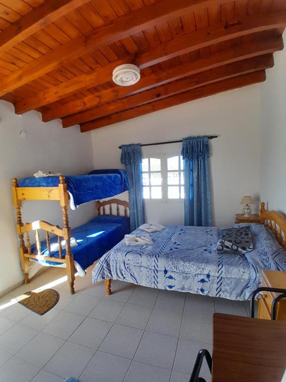 Postel nebo postele na pokoji v ubytování Hotel Rincon Serrano