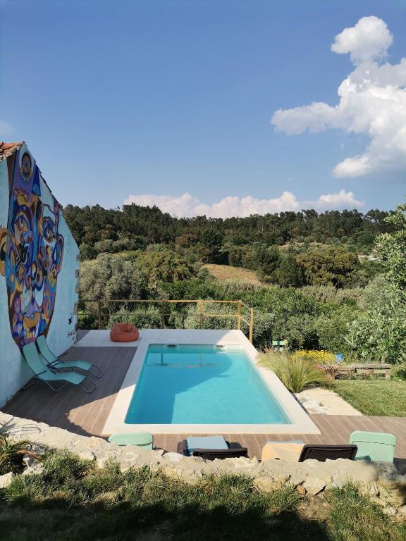 a swimming pool in the middle of a yard at Lameira Da Longra - Wellness Retreat in Tomar