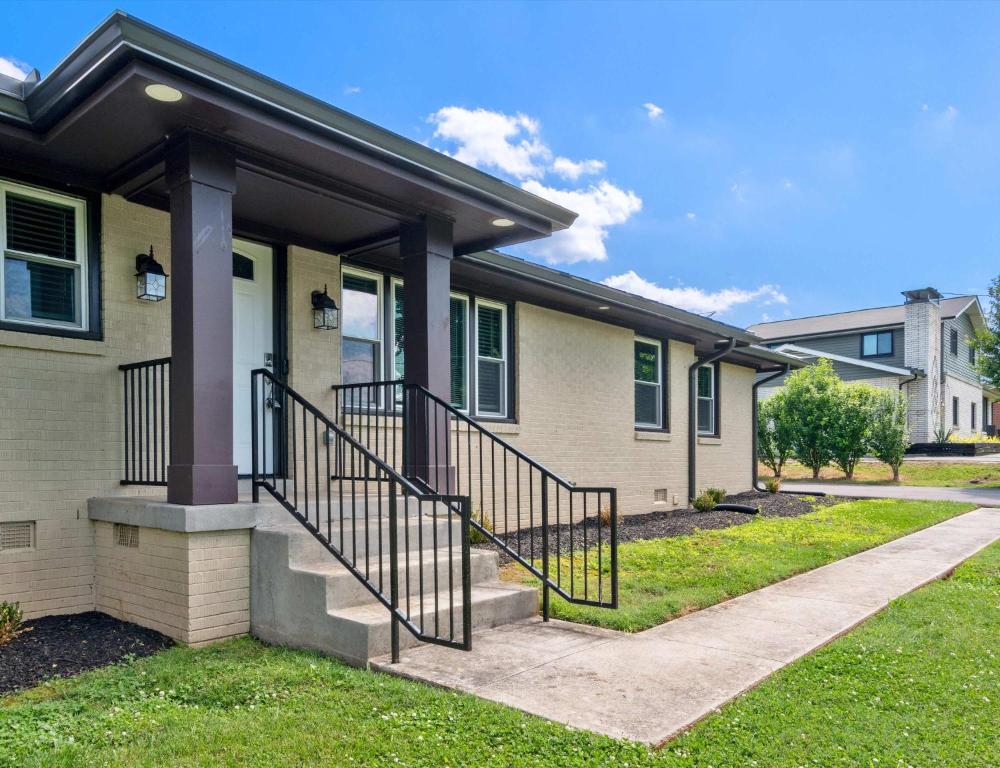 a house with a staircase in front of it at Diana's Place - 6 BDR Ranch Long or Short Stays in Murfreesboro