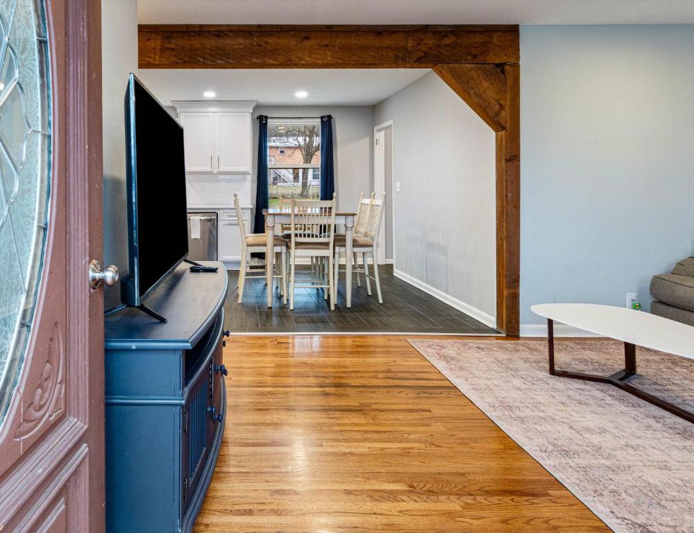 a living room with a television and a dining room at Cozy Franklin Hideaway - For 5 in Franklin