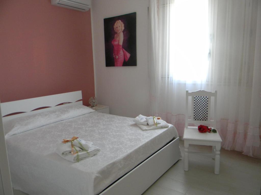 Postel nebo postele na pokoji v ubytování B&B Giorgio La Pira