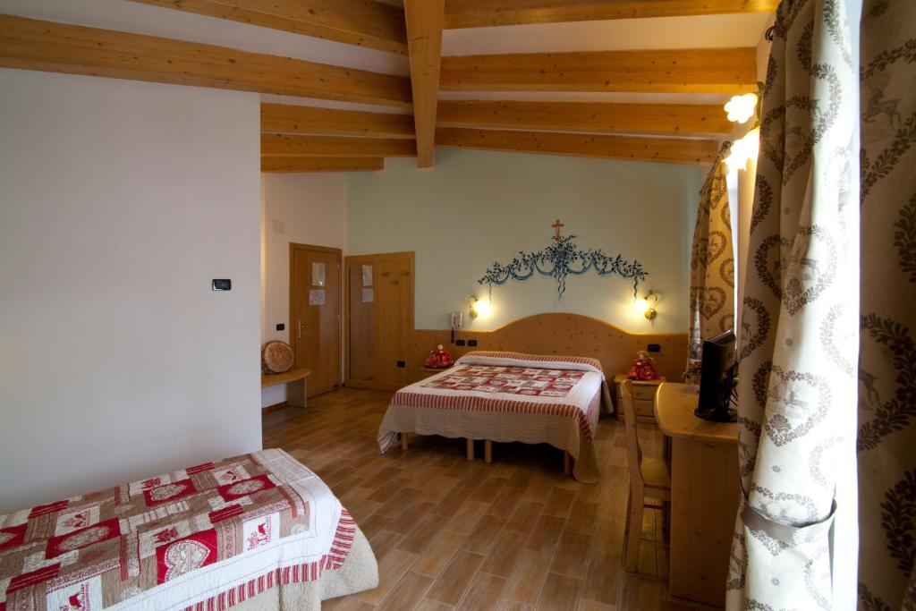 Postel nebo postele na pokoji v ubytování Hotel Sport