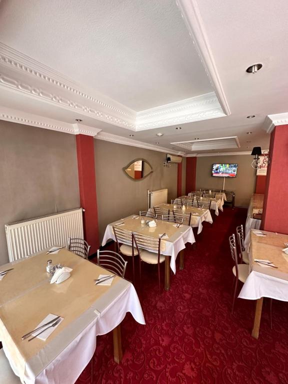a row of tables in a dining room at Minabir Otel in Ankara
