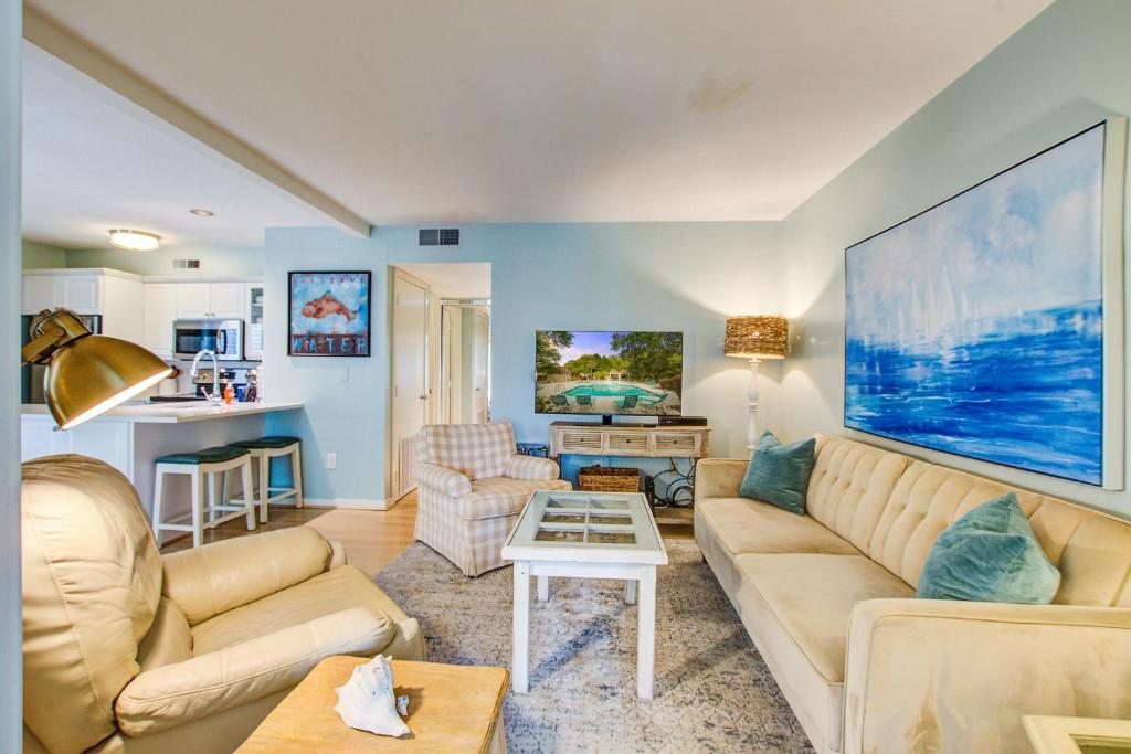 a living room with a couch and a table at 1641 Courtside in Seabrook Island