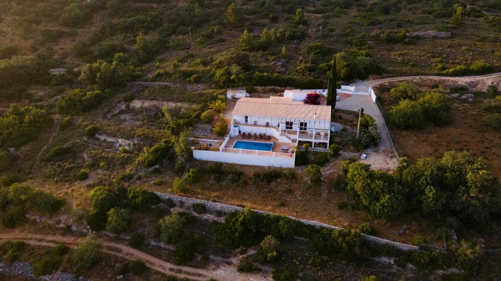 an aerial view of a house with a swimming pool at Carpe Diem in Faro