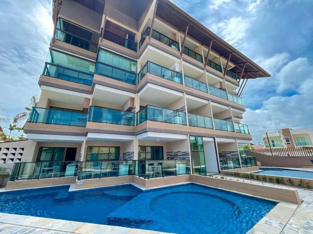 Πισίνα στο ή κοντά στο Edf Tangaroa Flats em Porto de Galinhas by BLU stay