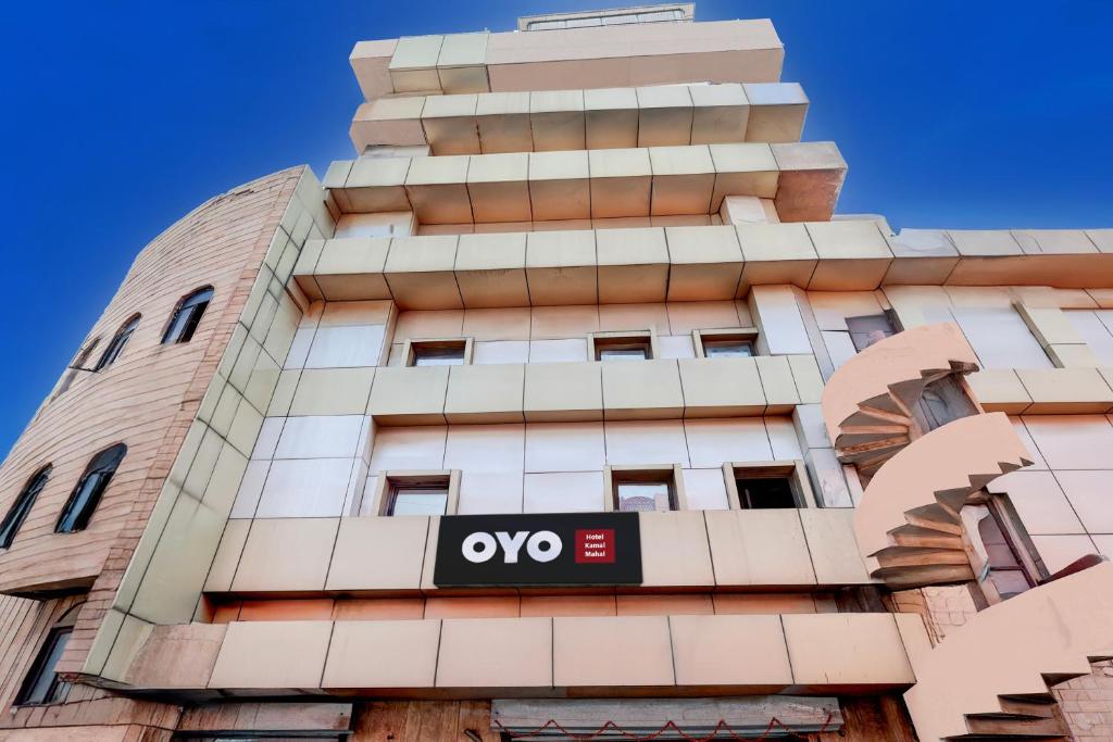 a building with an omega sign on it at Hotel O Kamal Mahal in New Delhi