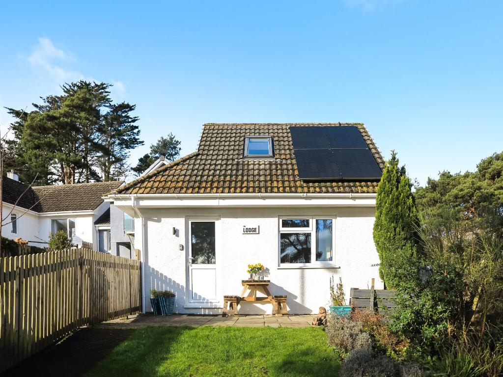 a house with a solar panel on the roof at The Lodge in Carlyon Bay