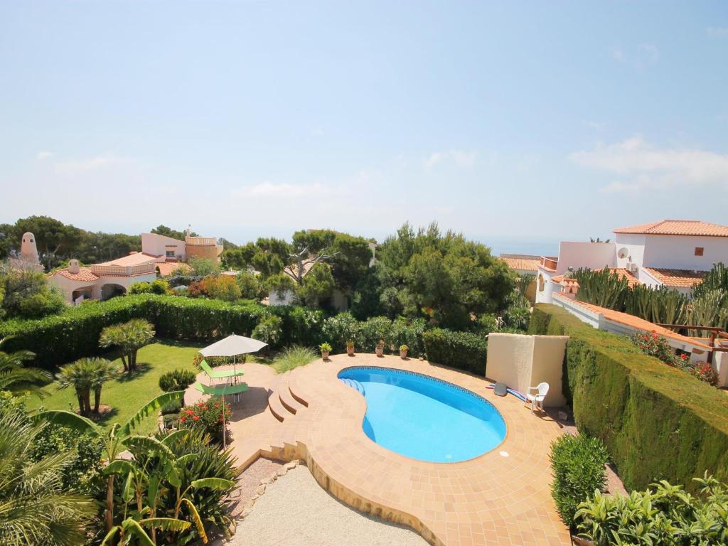 an image of a swimming pool in a yard at Calypso in Jávea