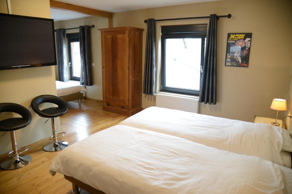 Postel nebo postele na pokoji v ubytování Race & Rooms