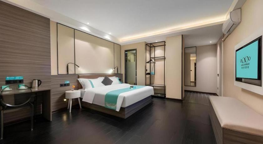 Ένα ή περισσότερα κρεβάτια σε δωμάτιο στο Xana Lite Jiangmen Yingbin West