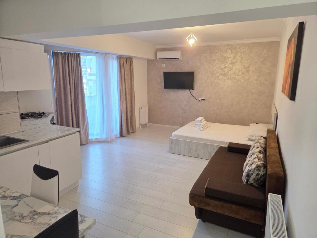 En eller flere senge i et værelse på C&Y Apartments Metropol