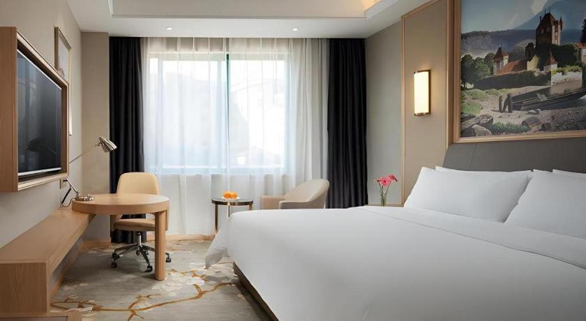 TV a/nebo společenská místnost v ubytování Vienna Hotel Guangzhou Yonghe Development Zone