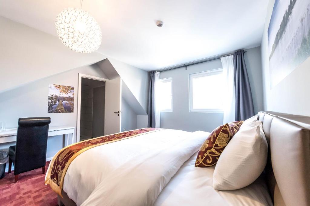 Postel nebo postele na pokoji v ubytování Hotel Temse
