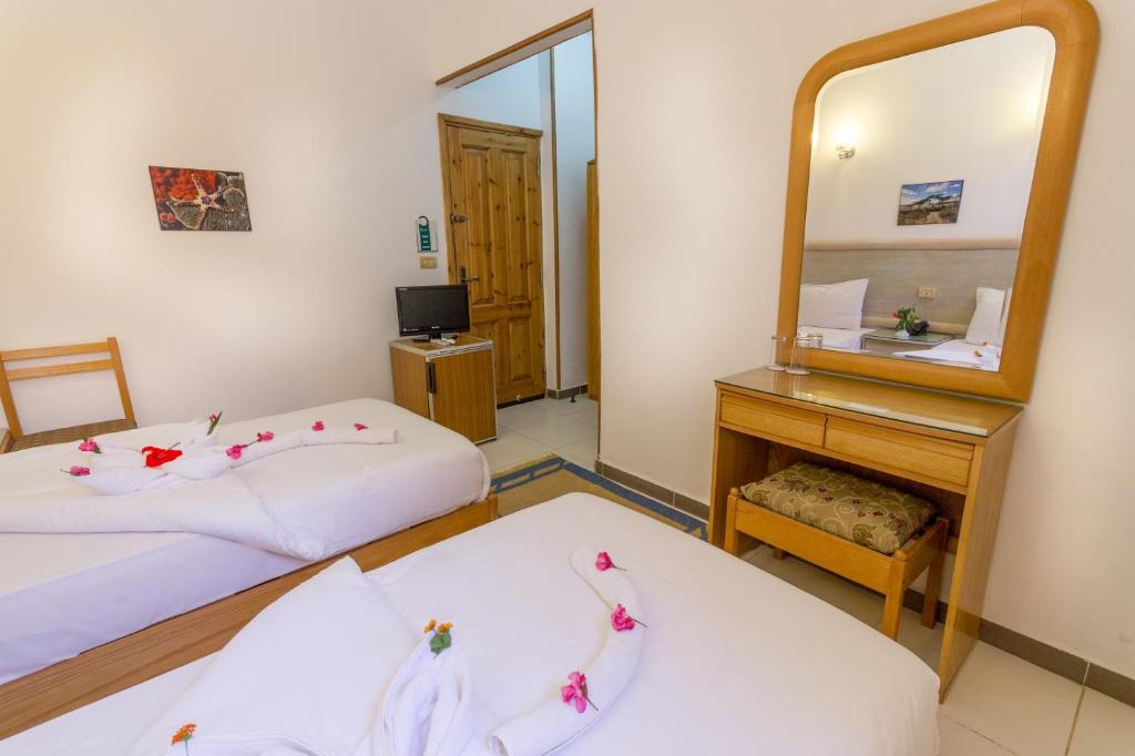 Postel nebo postele na pokoji v ubytování Acacia Dahab Hotel