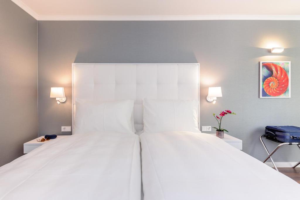 Postel nebo postele na pokoji v ubytování Mercure Hotel Raphael Wien