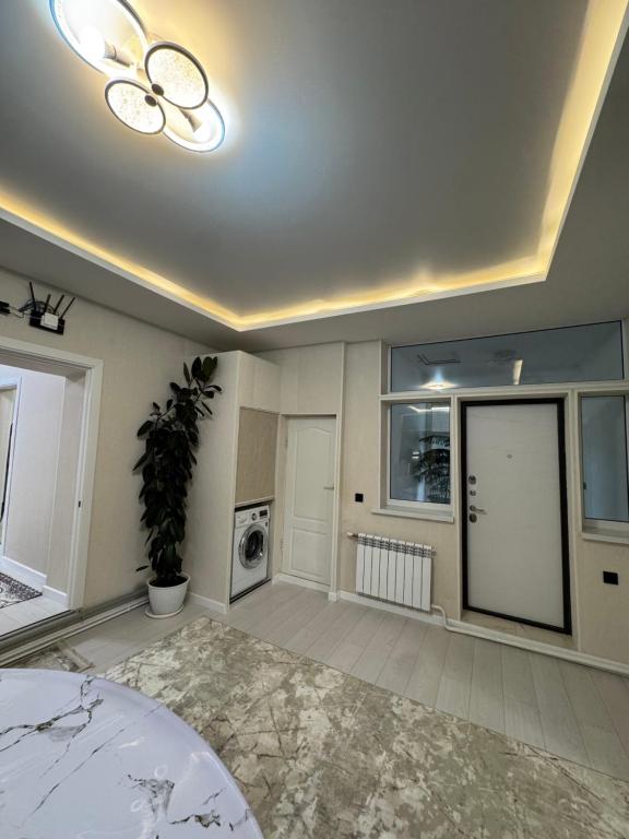 Postel nebo postele na pokoji v ubytování Guesthouse Gulmira