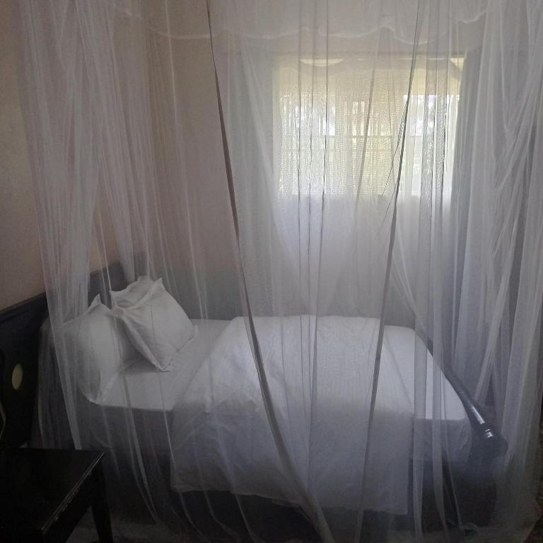 Ένα ή περισσότερα κρεβάτια σε δωμάτιο στο Birchwood Garden Hotel