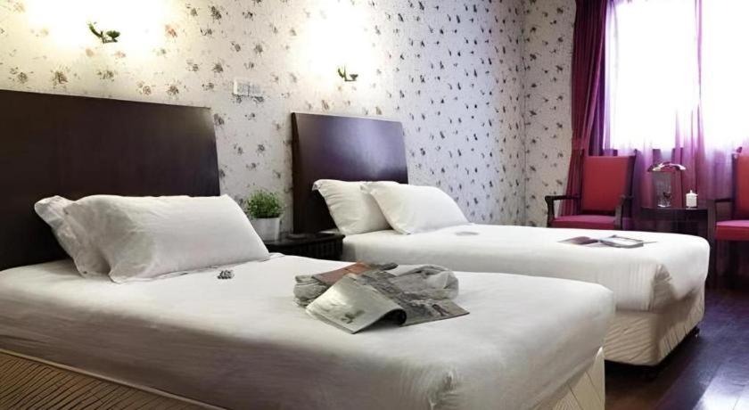 Ένα ή περισσότερα κρεβάτια σε δωμάτιο στο Shijia Inn On the Bund