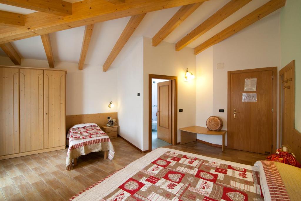 Postel nebo postele na pokoji v ubytování Hotel Sport