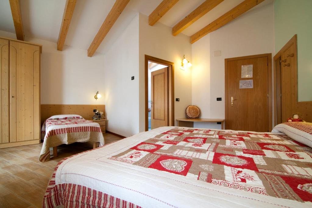 Postel nebo postele na pokoji v ubytování Hotel Sport