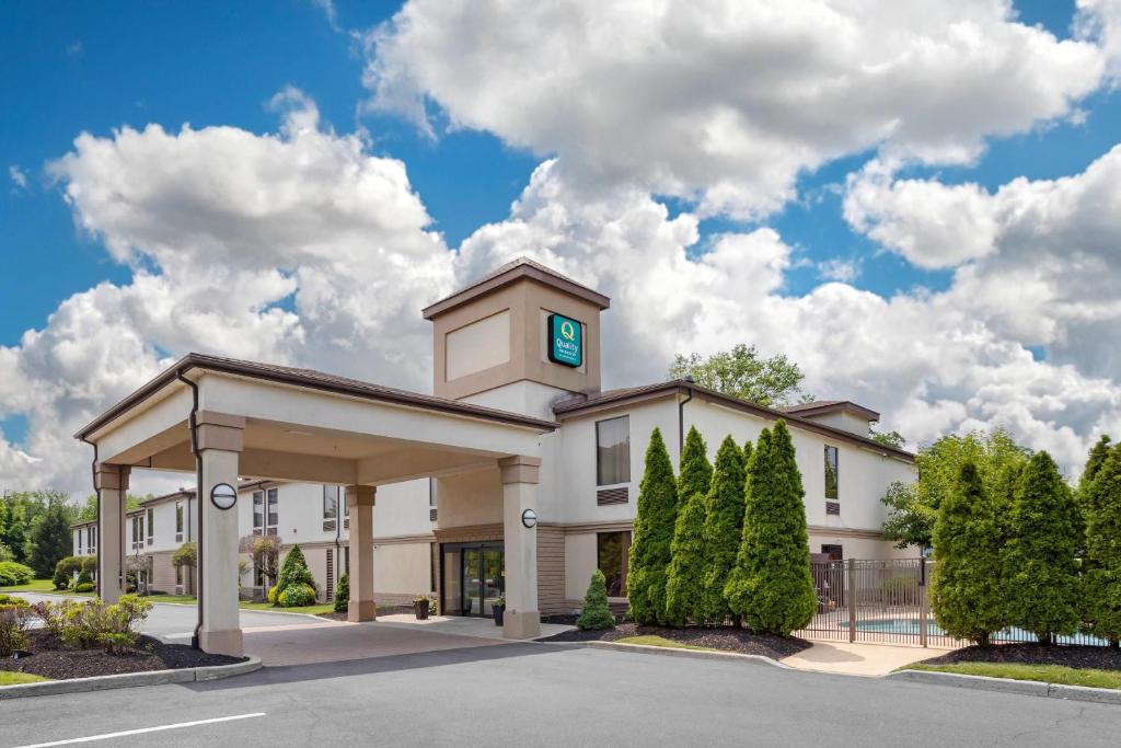 a building with a clock tower on top of it at Quality Inn & Suites NJ State Capital Area in Morrisville
