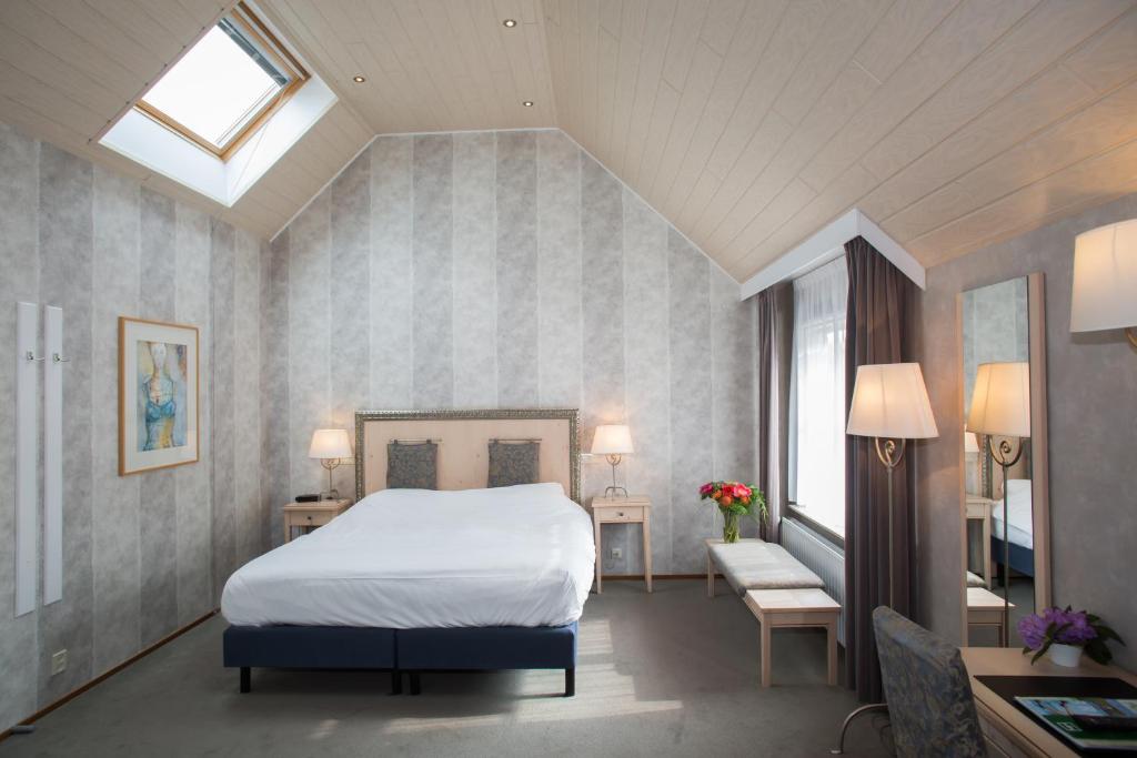 Postel nebo postele na pokoji v ubytování Landhotel De Hoofdige Boer