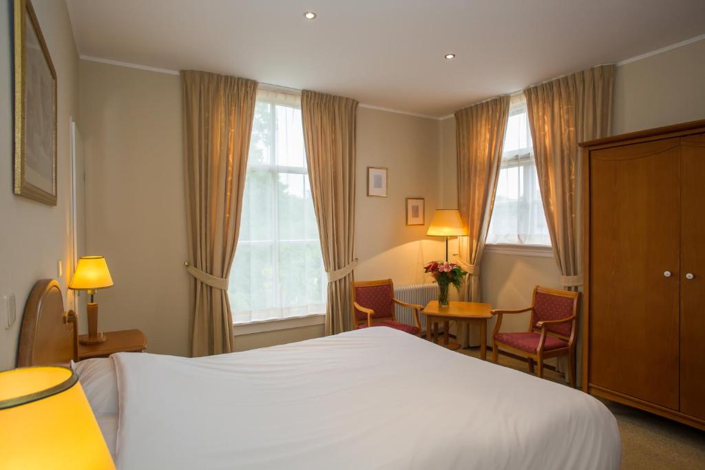 Postel nebo postele na pokoji v ubytování Landhotel De Hoofdige Boer
