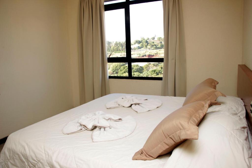 Postel nebo postele na pokoji v ubytování Hotel Midas