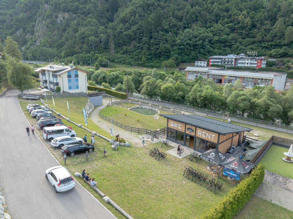 an aerial view of a building with cars parked in a parking lot at Appartamenti Bisoffi in Dimaro