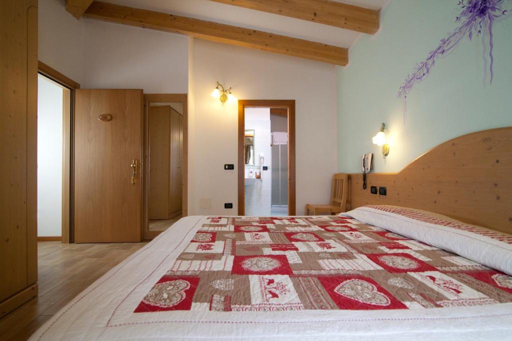 Postel nebo postele na pokoji v ubytování Hotel Sport