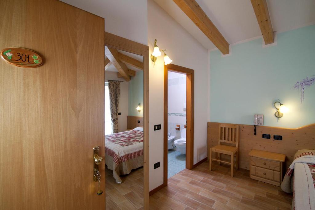 Postel nebo postele na pokoji v ubytování Hotel Sport